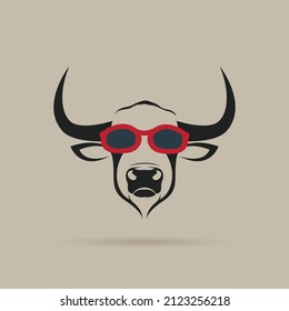 Vector of bull head wearing red sunglasses on brown background. Wild Animals. Animal fashion. Easy editable layered vector illustration.