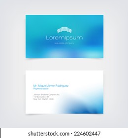 Vector business card design template with blue blurred unfocused bokeh background and a modern building logo