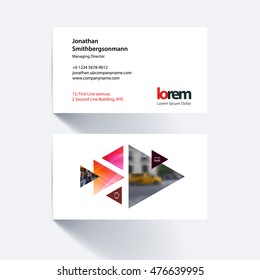 Vector business card template with moving triangles and arrows for business, construction, engineering. Simple and clean design. Creative corporate layout.