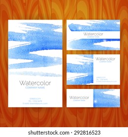 Vector Business Set Template with Blue Watercolor Abstract Splash. Background Template with Hand Drawn Splashes. Vector Illustration of Brand Identity for Business Company over Wooden Texture.