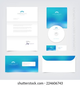 Vector business stationary design template with modern building logo and blue blurry unfocused bokeh background. Letter, envelope, cd and business cards. Modern branding collection.