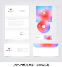 Vector business stationary design template with flying pelican silhouette logo and colorful blurry unfocused bokeh background. Letter, envelope, cd and business cards. Modern branding collection.