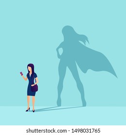 Vector of a businesswoman with superhero shadow. Symbol of ambition motivation leadership and challenge. Flat style. Vector illustration. EPS 10