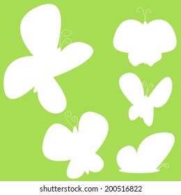 Vector, butterflies with opened wings, White silhouettes on green background