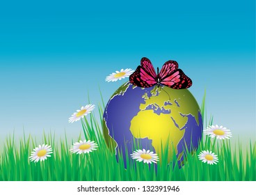 La mariposa vectora se sienta en un globo en la hierba.