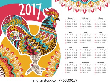 Calendario de vectores 2017. Colorido gallo - el símbolo del Año Nuevo chino.