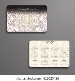 Vector calendar 2017 with decorative elements. Vector mandala design. Template can be used for web and print design.