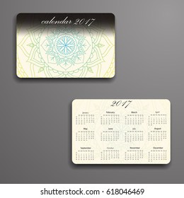 Vector calendar 2017 with decorative elements. Vector mandala design. Template can be used for web and print design.