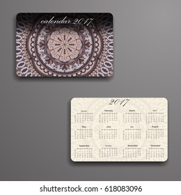 Vector calendar 2017 with decorative elements. Vector mandala design. Template can be used for web and print design.