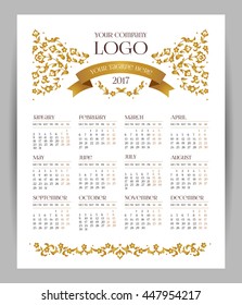 Vector calendar for 2017. Ornate decorated calendar grid. Golden floral decor, place for company logo and tagline, slogan. Template with week starts Monday.