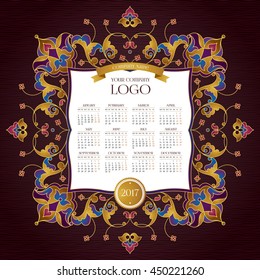 Vector calendar for 2017. Ornate decorated calendar grid. Bright floral decor, place for company logo and tagline, slogan. Template with week starts Monday.