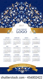 Vector calendar for 2017. Ornate decorated calendar grid. Bright floral decor, place for company logo and tagline, slogan. Blue flower and golden ribbon. Template with week starts Monday.