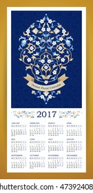 Vector calendar for 2017. Ornate decorated illustration, calendar grid. Bright floral decor, place for company slogan. Elegant bouquet of blue flowers, beige ribbon. Template with week starts Monday.