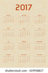 Vector calendar for 2017 in the retro style. Calendar with the image of the constellations on brown circle and beige scratched background. Elements for creative design ideas of your calendar