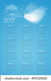 Vector calendar for 2017 year with background of blue sky and white flying fluffy feather. Week starts on sunday