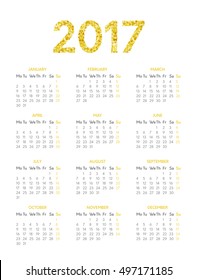 Vector calendar for 2017 year on white background with gold glitter effect. Week starts on monday