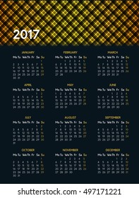 Vector calendar for 2017 year on dark background with shiny yellow pattern in header. Week starts on monday