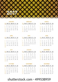 Vector calendar for 2017 year on white background with shiny yellow pattern in header. Week starts on sunday