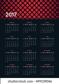Vector calendar for 2017 year on dark background with shiny red pattern in header. Week starts on sunday