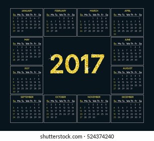Vector calendar for 2017 year on dark background with gold glitter text effect. Week starts on sunday