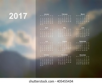 Vector calendar template. 2017 year. Blurred nature background. Week starts on Monday