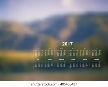 Vector calendar template. 2017 year. Blurred nature background. Week starts on Monday