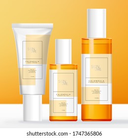 Cuidados de piel, belleza o productos de tocador con botella de naranja transparente y tubo blanco.