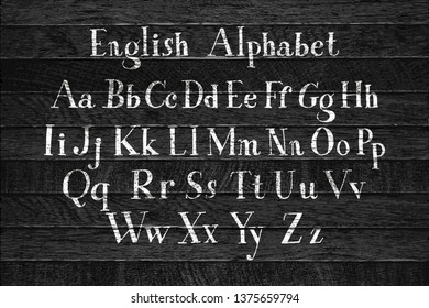Alfabeto caligráfico Vector. Conjunto de hermosas cartas escritas a mano. Clásico inglés abc. Los personajes de Latina están en el fondo de madera. Ilustración vectorial