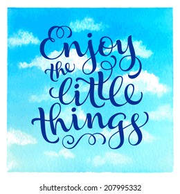 Vector calligraphic inscription with ornamental elements on watercolor background. "Enjoy the little things" poster or postcard. Typography collection
