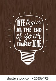  Vector calligraphic inscription with ornamental elements on wood background. "Life begins at the end of your comfort zone" poster or postcard. Typography collection