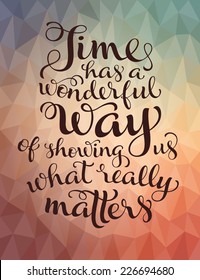 Vector calligraphic inscription with ornamental elements on colorful geometric background. "Time has a wonderful way of showing us what really maters" poster or postcard. Typography collection