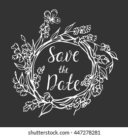 Vector calligraphy. Vintage typography card. Save the date lettering in wreath floral frame for wedding day. Rustic doodle elements.