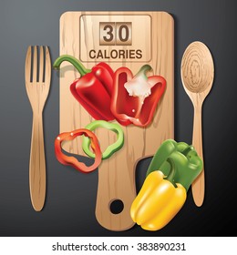 Vector of Calories in yellow, red and green pepper bell on wood board with wood spoon and wood fork.