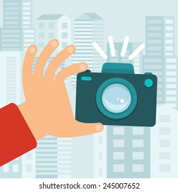 Vector camera in flat style - taking photo