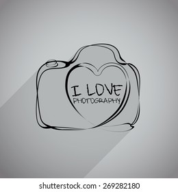 Vector: camera icon with heart-shaped. Doodle hand drawn sign in sketch childish style.