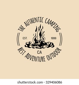 Vector camp logo. Tourism sign with hand drawn bonfire illustration. Retro hipster emblem, badge, label of outdoor adventures.