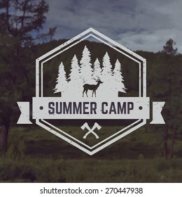 vector camping emblem. outdoor activity symbol with grunge texture on mountain landscape background