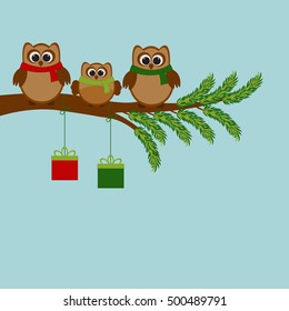 Vector card with Christmas theme. A family of owls sitting on the branch of a tree.