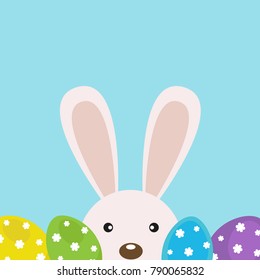 Vector card for Easter. Cute rabbit with Easter eggs.