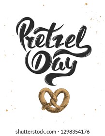 Vector card with hand drawn unique typography design element for greeting cards, decoration, prints and posters. Pretzel day with sketch of baked pretzel. Handwritten funny slogan lettering.