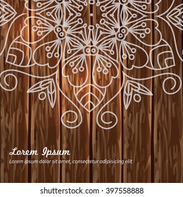 Vector card with mandala. Vector background. Card or invitation. Wedding invitation. Lace ornament, round ornament. East style. Mandala wooden background