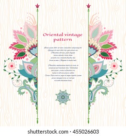 Vector card with pattern imitating wooden texture. Indian oriental traditional flower. Hand drawing. Place for your text.