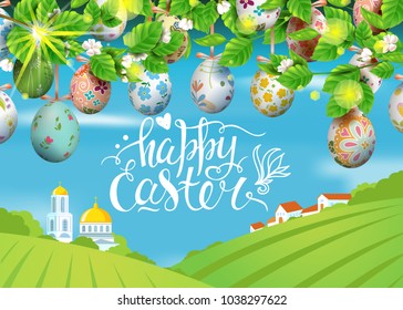 Vector card with realistic decorated 3D eggs hang on and blossom cherry tree. Handwritten calligraphy iinscription Happy Easter. Bright sunny background with village and church. Landscape.