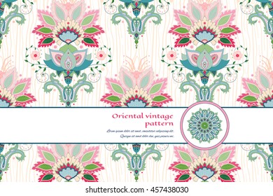Vector card with ribbon. Oriental indian traditional flower. Pattern imitating wooden texture on backdrop. Hand drawing. Place for your text.