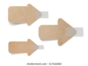 Vector cardboard arrow labels attached with a sticky tape