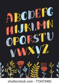 Vector cartoon Boho colorful slanted alphabet. Vector ethnic letters and arrows. Cute and funny ABC uppercase letters on dartk background, decorated with flowers for your design.