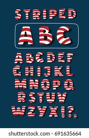 Vector cartoon funny Christmas striped candy cane alphabet letters. White and red stirpes on blue background