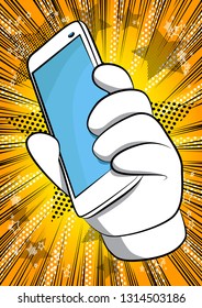 Vector cartoon hand holding a cell phone. Illustrated hand with smart phone on comic book background.