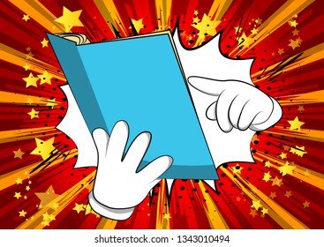 Vector cartoon hand holding and pointing at an opened book. Illustrated hand on comic book background.