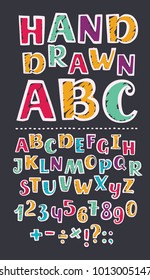 Vector cartoon illustration of Colorful kids abc and numbers set with marker strokes texture. Division sign, multiplication, plus, equals on black background. Hand drawn imitation doodle.
